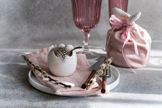 Easter table setting with pastel colors and spring decoration