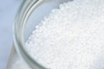Urea granules (carbamide, CO(NH2)2) - nitrogenous mineral fertilizer.
