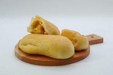 bread on a wooden cutting board. isolated background