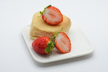 bread with strawberries on a white plate