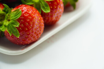 close-up of fresh strawberries on a plate