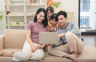 Fototapeta premium Young Asian family at home