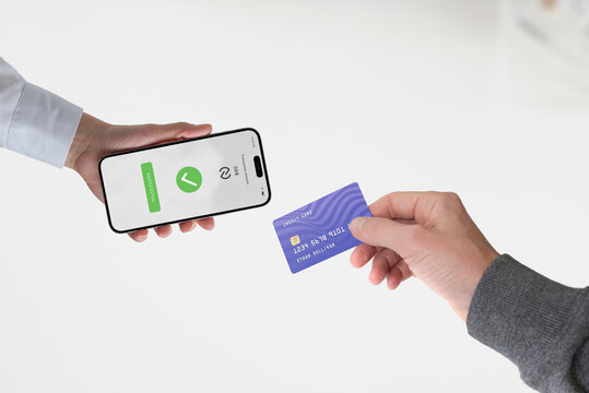 Credit card completing payment on a smartphone held by a vendor, with an NFC icon and a "Payment Successful" message displayed on the screen