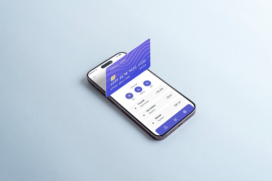 Credit card emerging from a smartphone on a table, displaying a digital wallet app. Concept of managing accounts, credit cards, and expenses