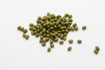 Flat lay (top view) of Mung bean (Vigna radiata) seeds isolated on white background.
