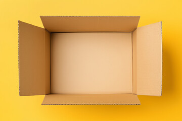 empty cardboard box viewed from above on yellow background