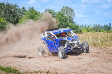 UTV buggy, rally or 4x4 in the action on sand