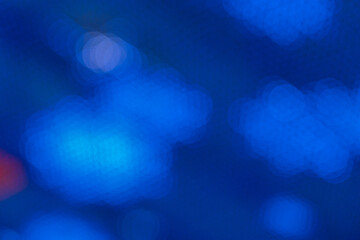 View on blue abstract background with bokeh defocused lights. New Year, Christmas