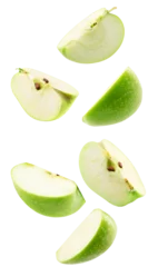  falling slices of green apple isolated on a white background © Iurii Kachkovskyi