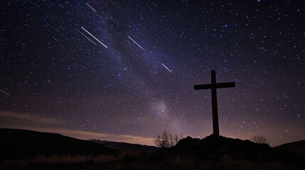 A cross is standing in the middle of a starry sky
