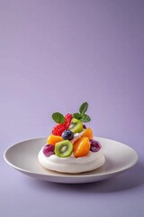 Delightful pavlova dessert topped with fresh fruits on a smooth plate against a muted purple background