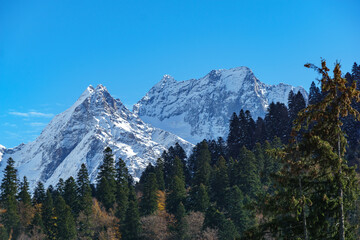 Picturesque landscape in Dombay with amazing snow-capped peaks and majestic blue slopes of North ...