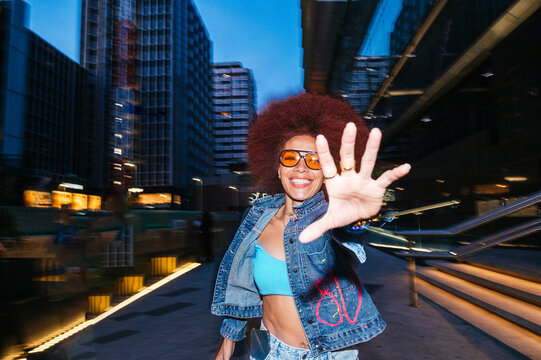African descendent woman with afro hair in urban setting