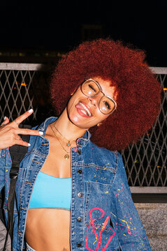 Fashionable African descendant woman with vibrant afro hair