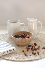 a cup of coffee ,milk and nuts in white background