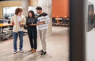 Coworkers Engaged in Teamwork at a Modern Office Setting