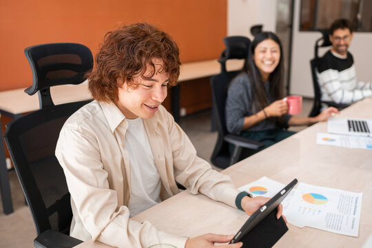 Coworkers Collaborating in a Modern Office Environment