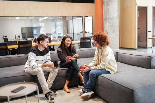 Casual office meeting with positive coworker interaction