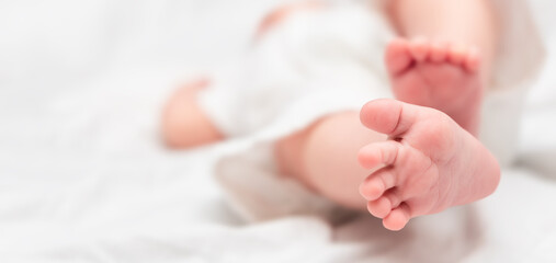 baby's feet close-up on a light background