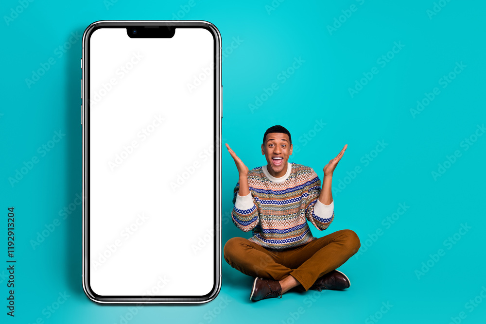 Poster full size photo of nice young man empty space smart phone display isolated on teal color background