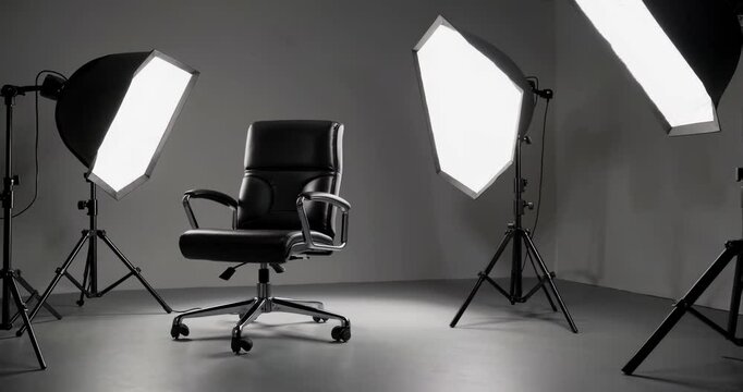 leather chair and professional lighting equipment in a video studio
