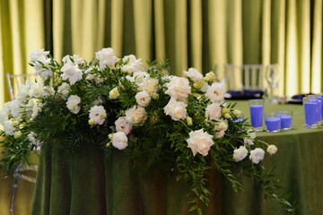 Elegant floral arrangement graces a beautifully decorated table for a special event