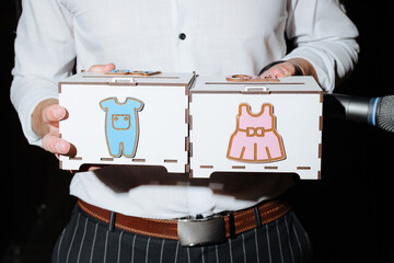 Fun and games at a baby shower celebration with creative gender reveal boxes