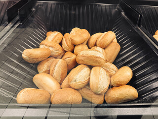 Crispy buns in the bakery, breakfast, flour, Polish bread, shopping in the supermarket