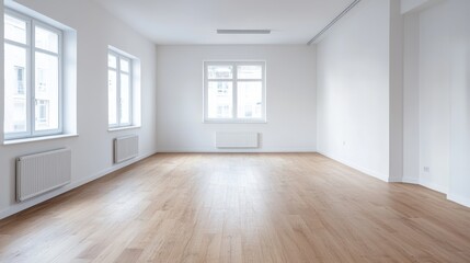 Obraz premium Empty room with wooden flooring and white walls illuminated by natural light