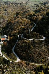 A winding paved mountain road in golden autumn season. Beautiful nature of southwestern Serbia....
