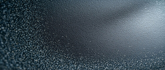 Black texture surface details with subtle grainy effect for design projects