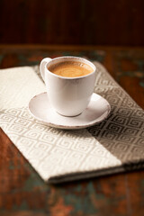 Cup of coffee on wooden background. Soft focus. Copy space.