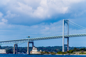 A view across Narragansett bay towards Rose Island and the Newport bridge at Newport, USA in the fall