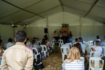 farmers at a field day learning on a farm. learning about agriculture and innovation listen to experts. farming community together in for a growers field day talking to agronomist