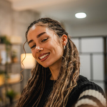 beautiful smiling young woman take a self portrait and pose at home
