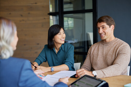 Multiethnic couple meeting financial advisor