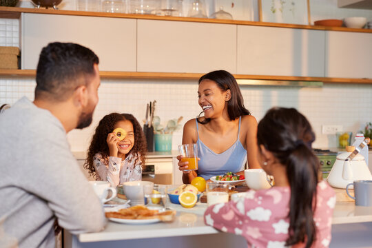 Family enjoying breakfast with fun and love