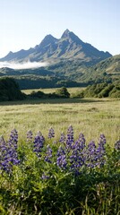 Fototapeta premium Serene Early Morning Light Spilling Over Misty Landscape with Mountains and Wildflowers