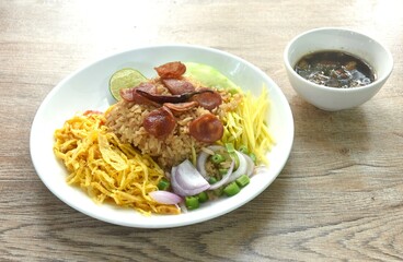 fried rice mixed with shrimp paste eat couple egg and vegetable on plate