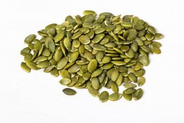 Dried pumpkin seeds isolated on white background.