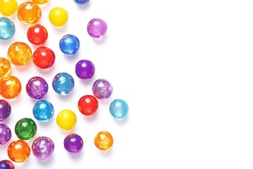 Colorful marbles scattered against bright background create play