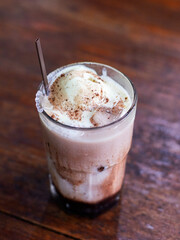 Cold chocolate milkshake with delicious vanilla ice cream topping ready to serve