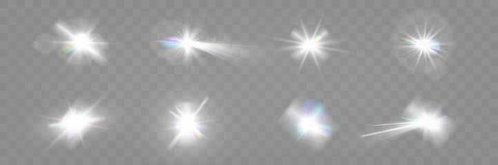 Set of glowing light effects with starbursts and radiating beams on a transparent background, ideal for overlays and decorations.