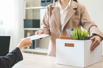 Unemployment quitting job, desperate asian young business woman send resignation letter to boss,...