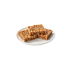 Delicious Caramel Squares: Three appetizing caramel squares are neatly arranged on a simple, clean plate, tempting viewers with their rich textures and inviting appearance.