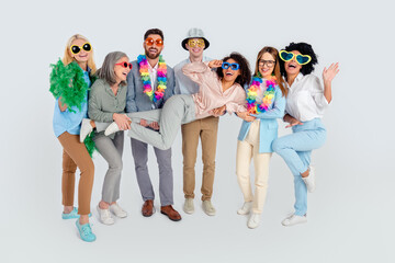 Fototapeta premium Diverse group of cheerful business professionals celebrating teamwork in colorful outfits and office formalwear