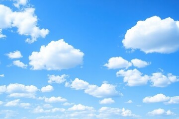 Fototapeta premium A serene sky filled with fluffy white clouds against a bright blue backdrop, creating a peaceful and calming atmosphere.