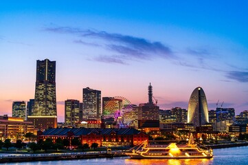 sweet sunset winter and light illumination from Cityscape of Yokohama city, Skyline and office building and downtown in  Minatomirai Area, Yokohama city port, Kanagawa, Japan