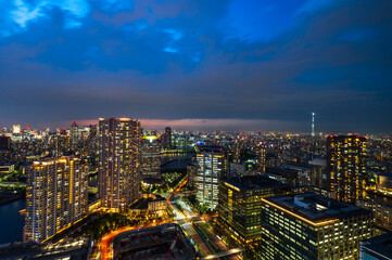 Nightlight Cityscape of Tokyo, city aerial skyscraper view of office building and downtown and street of minato in tokyo with twilight sky background. Japan, Asia