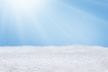 Christmas background with snowdrift, falling snow and sun rays with copy space. Empty winter background. Banner, website header, poster with cope space.